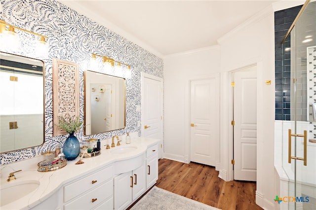 bathroom featuring hardwood / wood-style floors, an enclosed shower, vanity, and crown molding