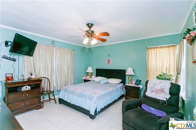 bedroom featuring ceiling fan and crown molding