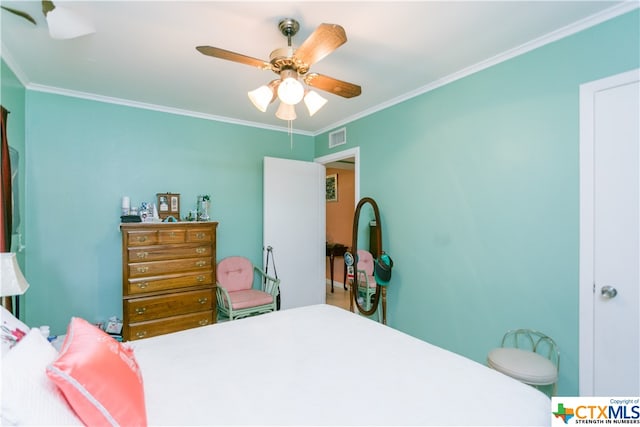 bedroom featuring ornamental molding and ceiling fan