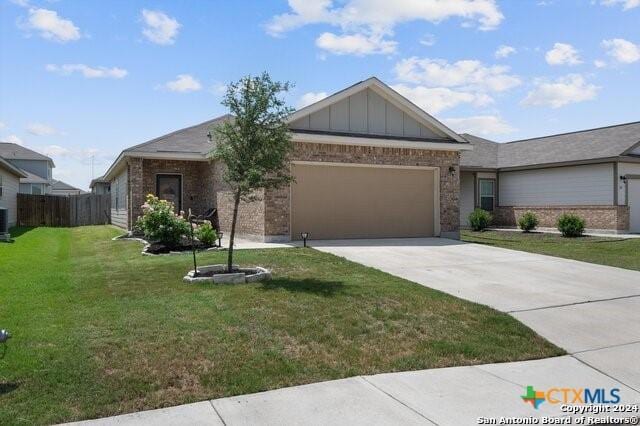 single story home featuring central AC unit, a front lawn, and a garage