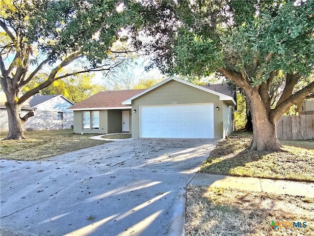 single story home with a garage