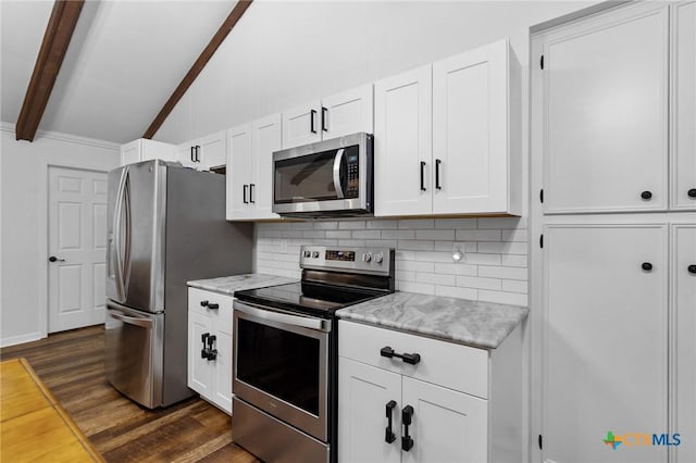 301 King Arthur St, Victoria, TX 77904 - kitchen with stainless steel appliances, dark wood finished floors, tasteful backsplash, and white cabinetry