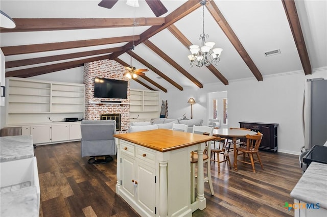 301 King Arthur St, Victoria, TX 77904 - kitchen with ceiling fan, open floor plan, dark wood-style floors, and freestanding refrigerator