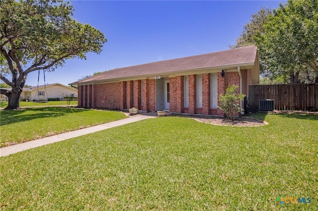 301 King Arthur St, Victoria, TX 77904 - ranch-style home with brick siding and central AC