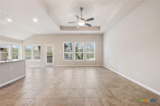 8113 Cannon Ct, Lago Vista, TX 78645 - unfurnished living room with ceiling fan, light tile patterned flooring, a tray ceiling, and recessed lighting