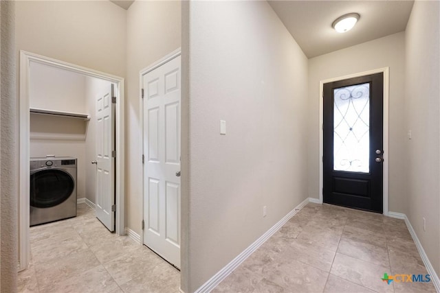 8113 Cannon Ct, Lago Vista, TX 78645 - entryway featuring washer / dryer and light tile patterned flooring
