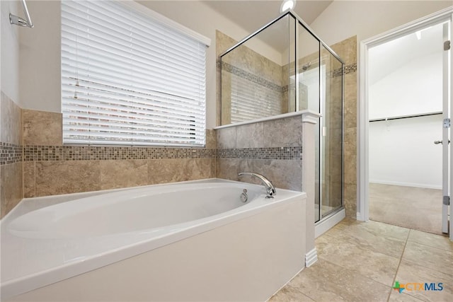 8113 Cannon Ct, Lago Vista, TX 78645 - full bathroom with a bath, a stall shower, and tile patterned floors