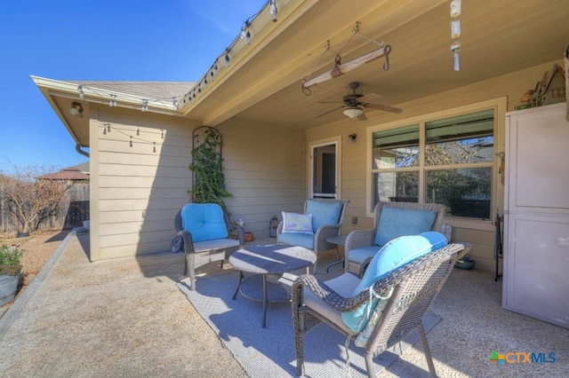 view of patio with ceiling fan and outdoor lounge area