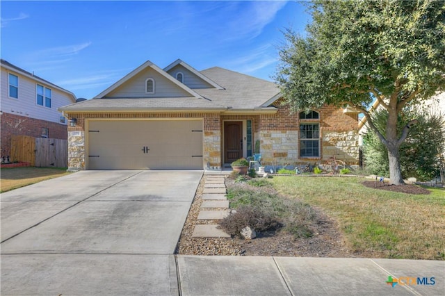 view of front of property featuring a garage and a front yard