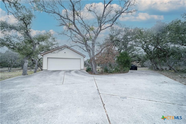 exterior space featuring an outbuilding and a detached garage