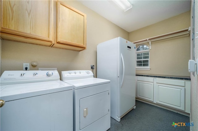 laundry area with cabinet space and independent washer and dryer