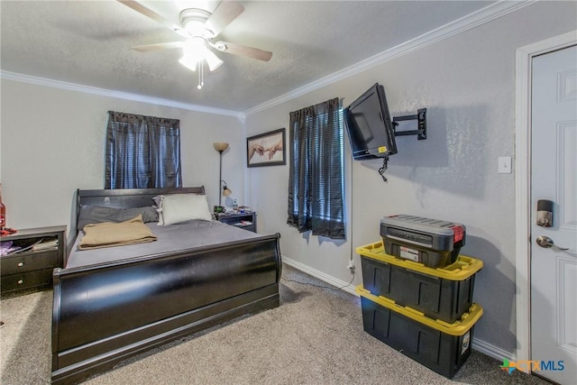 bedroom with carpet flooring, a textured ceiling, ceiling fan, and ornamental molding