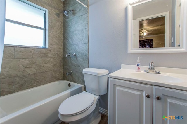 full bathroom featuring wood-type flooring, vanity, toilet, and tiled shower / bath