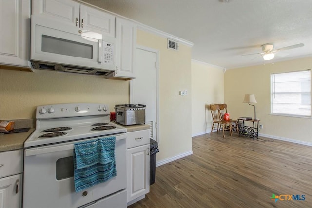 kitchen with ceiling fan, hardwood / wood-style floors, white cabinets, and white appliances