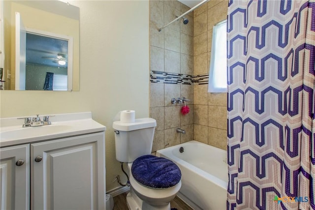 bathroom with vanity, ceiling fan, toilet, and a wealth of natural light