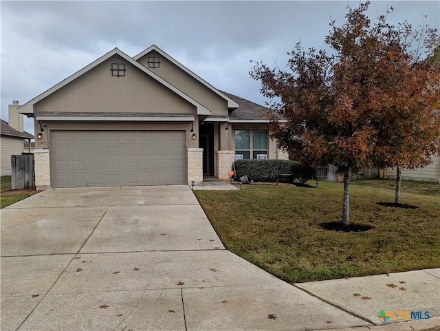 view of front of house with a garage and a front yard