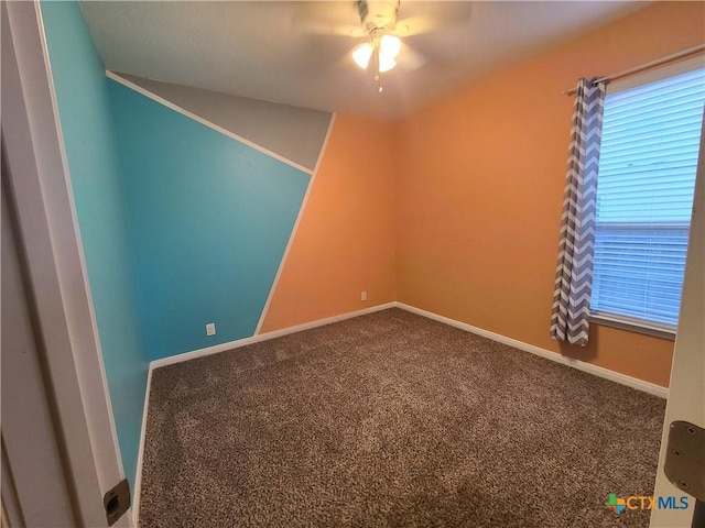 unfurnished room with carpet flooring and ceiling fan