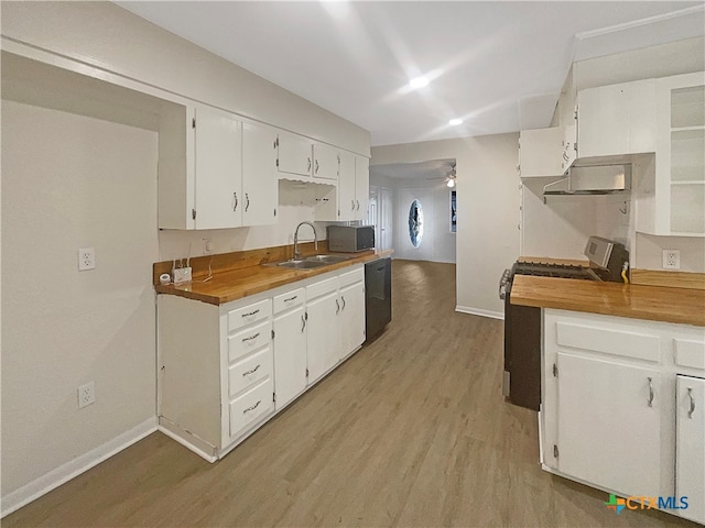 kitchen featuring light hardwood / wood-style floors, white cabinets, black dishwasher, range, and sink