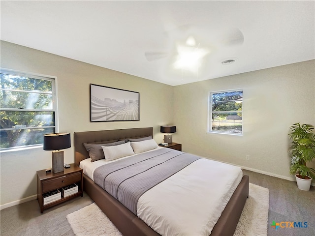 carpeted bedroom with ceiling fan