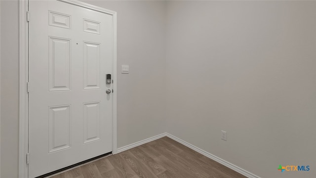 doorway with light hardwood / wood-style flooring