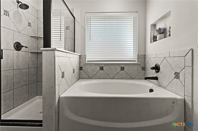 6505 Cassidy Ln, Killeen, TX 76542 - bathroom with plenty of natural light, a bath, and a stall shower