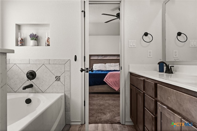 6505 Cassidy Ln, Killeen, TX 76542 - ensuite bathroom featuring wood finished floors, vanity, a bath, and a ceiling fan