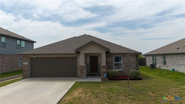 6505 Cassidy Ln, Killeen, TX 76542 - view of front of property featuring an attached garage, brick siding, driveway, a front yard, and central air condition unit