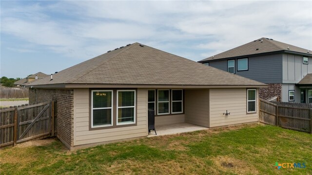 6505 Cassidy Ln, Killeen, TX 76542 - back of house featuring a patio, roof with shingles, and brick siding