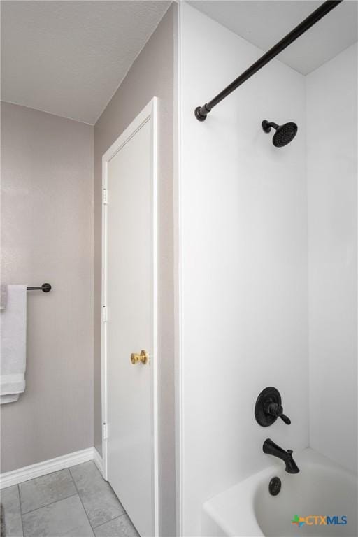 bathroom with shower / bathing tub combination and tile patterned floors