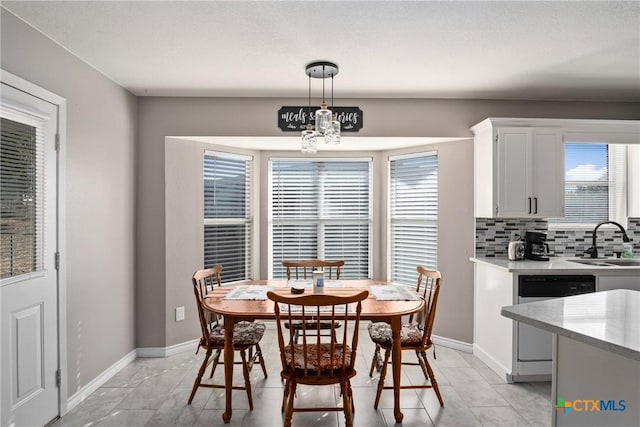 dining space featuring sink