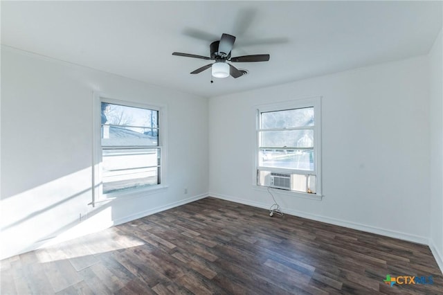 unfurnished room featuring ceiling fan, cooling unit, and dark hardwood / wood-style floors