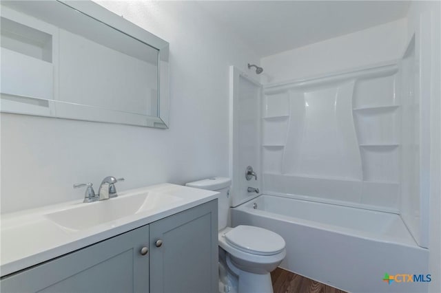 full bathroom with wood-type flooring, vanity, toilet, and shower / tub combination