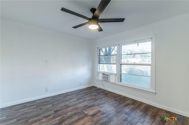 spare room featuring ceiling fan, cooling unit, and dark hardwood / wood-style flooring