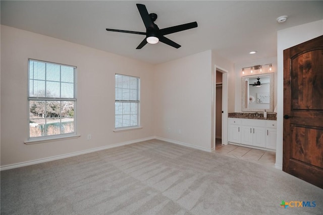 194 Panorama Ln, Victoria, TX 77905 - unfurnished bedroom featuring light carpet, baseboards, ensuite bathroom, recessed lighting, and ceiling fan