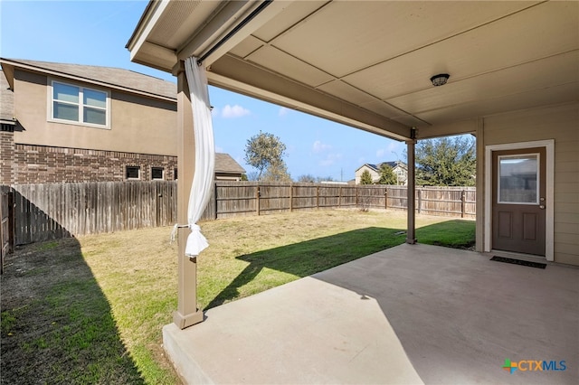 view of yard with a fenced backyard and a patio