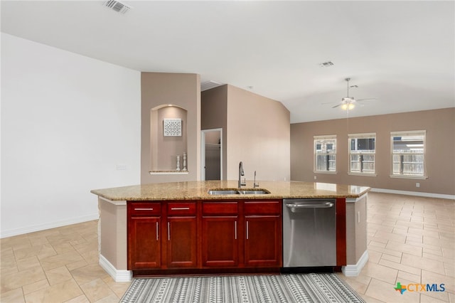 kitchen featuring visible vents, a sink, stainless steel dishwasher, open floor plan, and reddish brown cabinets