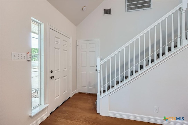 2033 Northview Dr, San Marcos, TX 78666 - foyer entrance featuring wood finished floors, stairway, and high vaulted ceiling