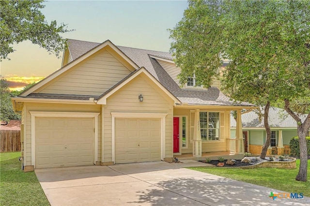 2033 Northview Dr, San Marcos, TX 78666 - view of front of home with concrete driveway, covered porch, a garage, and a shingled roof