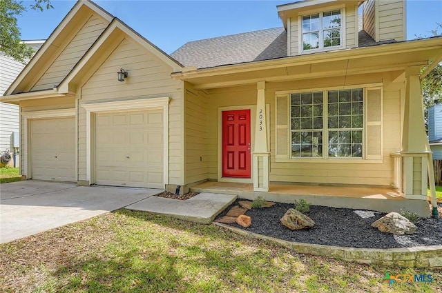 2033 Northview Dr, San Marcos, TX 78666 - view of front of house with concrete driveway, an attached garage, a porch, and roof with shingles