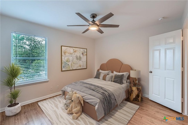 2033 Northview Dr, San Marcos, TX 78666 - bedroom featuring multiple windows, light wood-type flooring, and ceiling fan