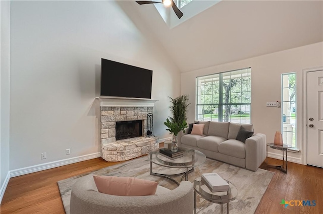 2033 Northview Dr, San Marcos, TX 78666 - living room featuring high vaulted ceiling, a ceiling fan, healthy amount of natural light, and wood finished floors