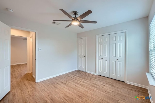 2033 Northview Dr, San Marcos, TX 78666 - unfurnished bedroom featuring light wood-style flooring and a ceiling fan