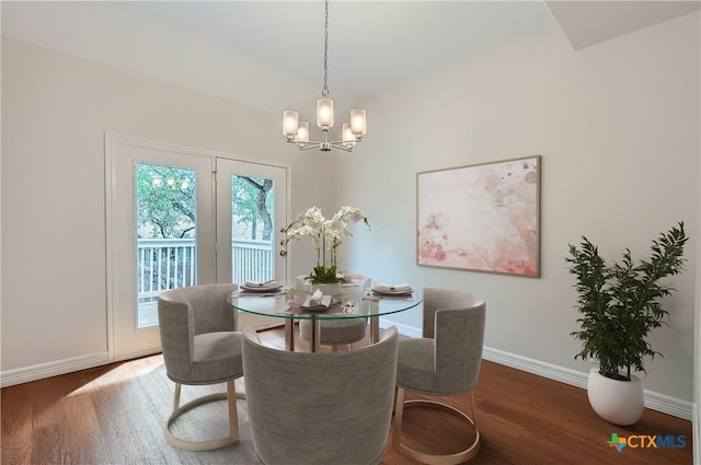2033 Northview Dr, San Marcos, TX 78666 - dining area with a chandelier and wood finished floors