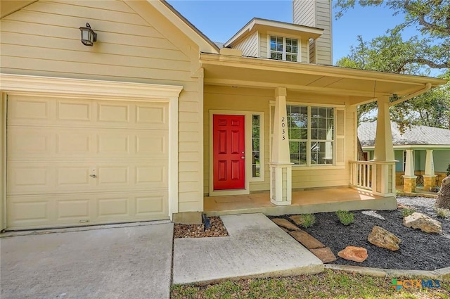 2033 Northview Dr, San Marcos, TX 78666 - property entrance featuring a porch, a chimney, concrete driveway, and an attached garage