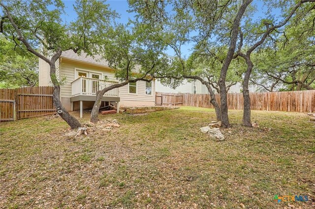2033 Northview Dr, San Marcos, TX 78666 - fenced backyard with a deck and a gate