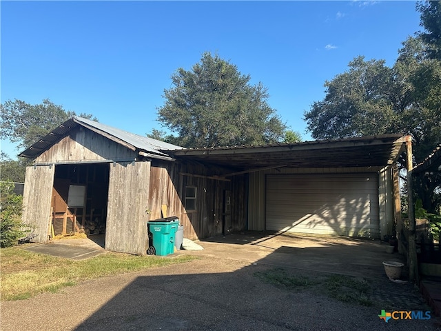 view of outdoor structure with a garage