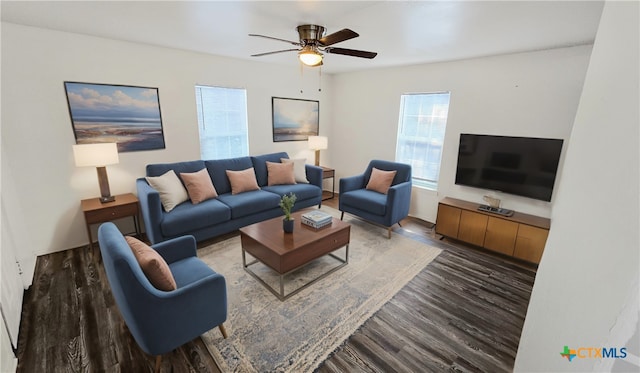 living room featuring hardwood / wood-style floors and ceiling fan