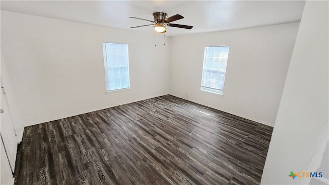 unfurnished room featuring ceiling fan and dark hardwood / wood-style floors