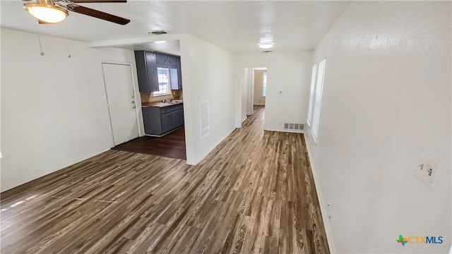 hallway featuring dark hardwood / wood-style flooring