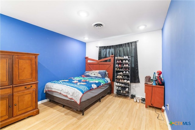 204 W Johnson St, Cuero, TX 77954 - bedroom featuring light wood-type flooring and baseboards